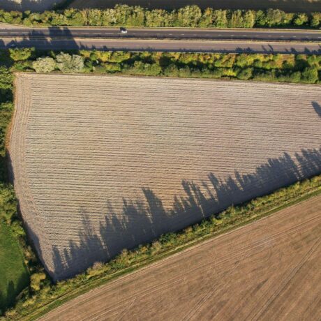 aerial image of agricultural field with main road to the right