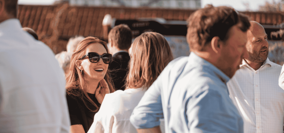 Image of women laughing and having a conversation