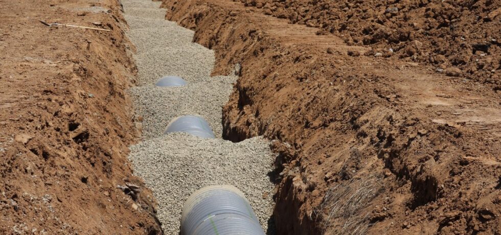 land drainage being implemented in a field